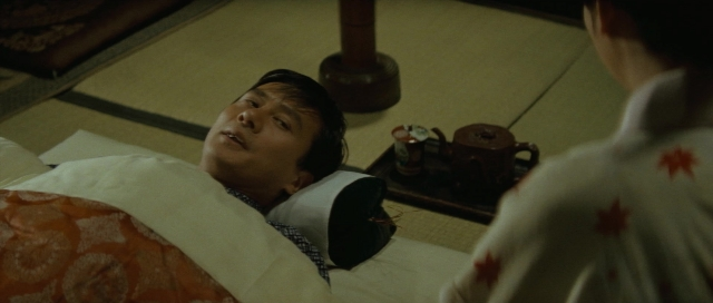 Wide shot frame from Kyôfu kikei ningen: Edogawa Rampo zenshû — bed, person, human face