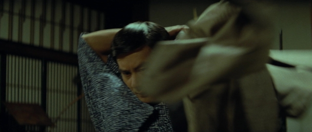 Medium shot frame from Kyôfu kikei ningen: Edogawa Rampo zenshû — bed, person, human face