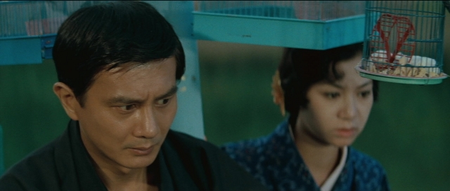 Medium shot frame from Kyôfu kikei ningen: Edogawa Rampo zenshû — standing, food, face