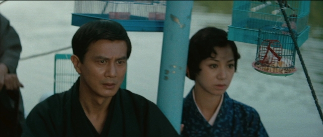 Wide shot frame from Kyôfu kikei ningen: Edogawa Rampo zenshû — sitting, hand, water