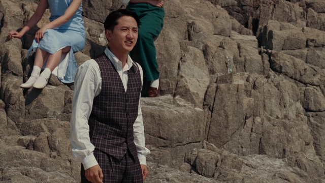 Medium shot frame from Se, jie — sitting, standing, dress