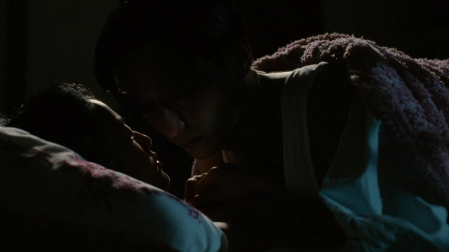Wide shot frame from Se, jie — room, bed, shirt