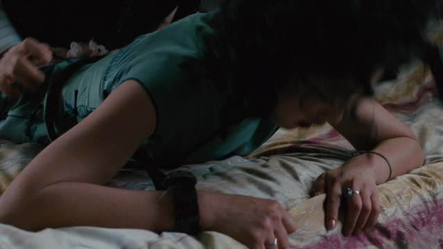 Wide shot frame from Se, jie — bed, hand, hair