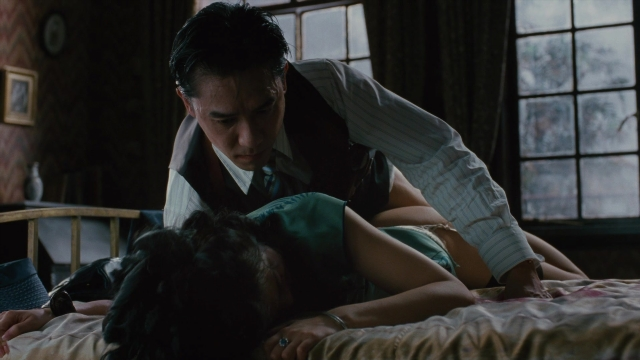 Wide shot frame from Se, jie — room, bed, shirt