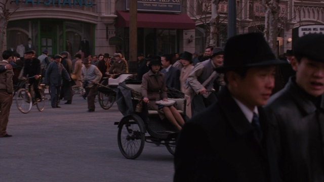 Wide shot frame from Se, jie — sitting, standing, walking