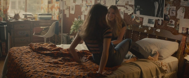Wide shot frame from The Diary of a Teenage Girl — sitting, room, dialogue