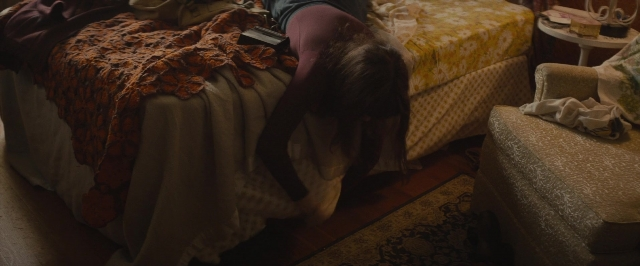 Wide shot frame from The Diary of a Teenage Girl — room, table, bed