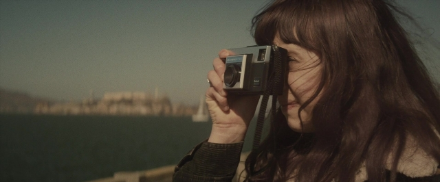 Wide shot frame from The Diary of a Teenage Girl — standing, water, face