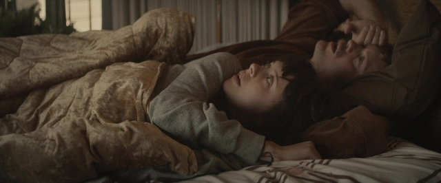 Wide shot frame from The Diary of a Teenage Girl — bed, person, human face