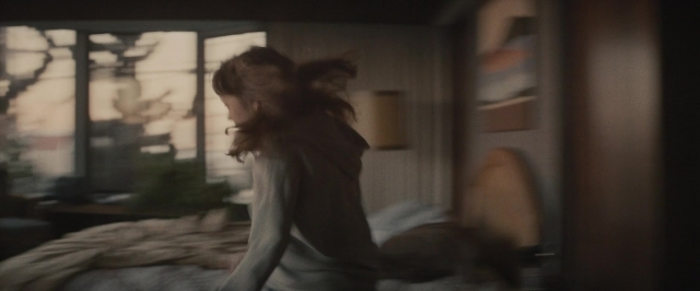 Medium shot frame from The Diary of a Teenage Girl — standing, room, bed