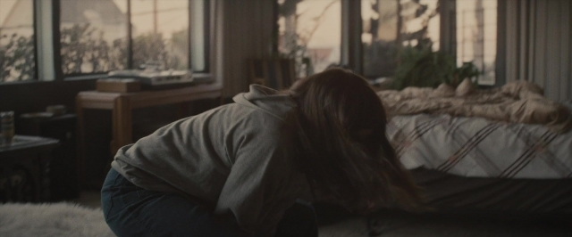 Wide shot frame from The Diary of a Teenage Girl — bed, lamp, furniture