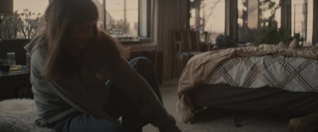 Wide shot frame from The Diary of a Teenage Girl — sitting, room, table