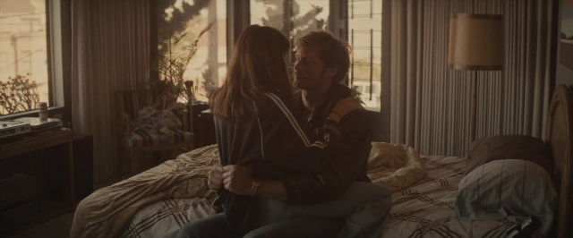 Wide shot frame from The Diary of a Teenage Girl — sitting, room, bed