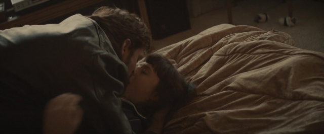 Frame from The Diary of a Teenage Girl — bed, lamp, person