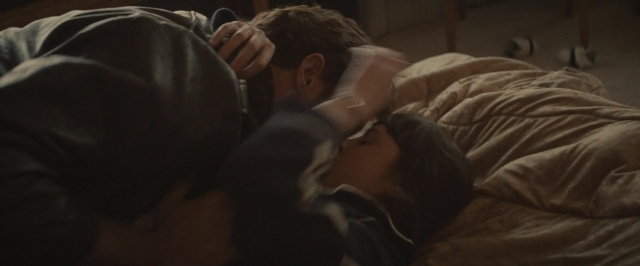 Wide shot frame from The Diary of a Teenage Girl — room, bed, person