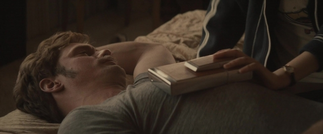 Frame from The Diary of a Teenage Girl — book, room, bed