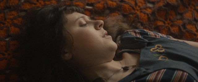 Wide shot frame from The Diary of a Teenage Girl — bed, shirt, hair