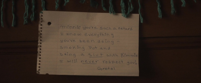 Frame from The Diary of a Teenage Girl — book, cigarette