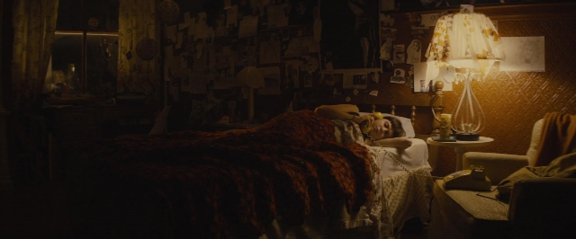 Wide shot frame from The Diary of a Teenage Girl — room, table, bed