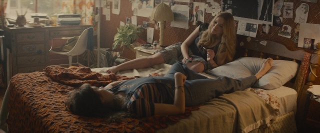 Wide shot frame from The Diary of a Teenage Girl — sitting, room, bed
