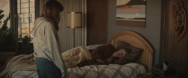 Frame from The Diary of a Teenage Girl — standing, room, bed