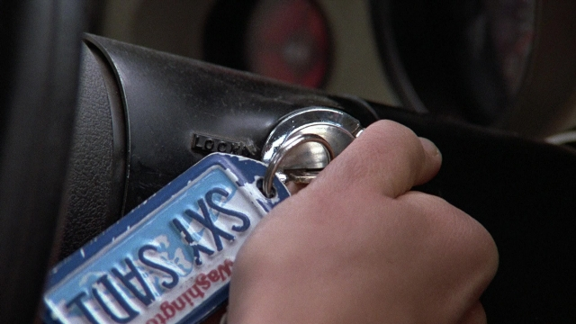 Frame from The Accused — plate, car, hand