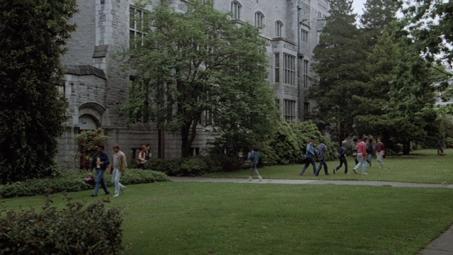 Wide shot frame from The Accused — walking, dialogue, street