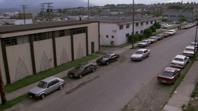 Frame from The Accused — street, car, wheel