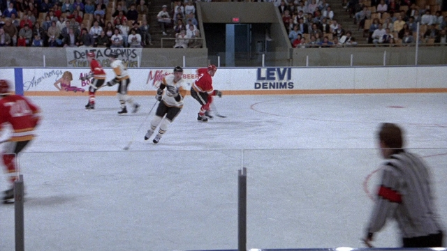 Wide shot frame from The Accused — person, footwear