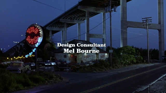 Wide shot frame from The Accused — street, night, person