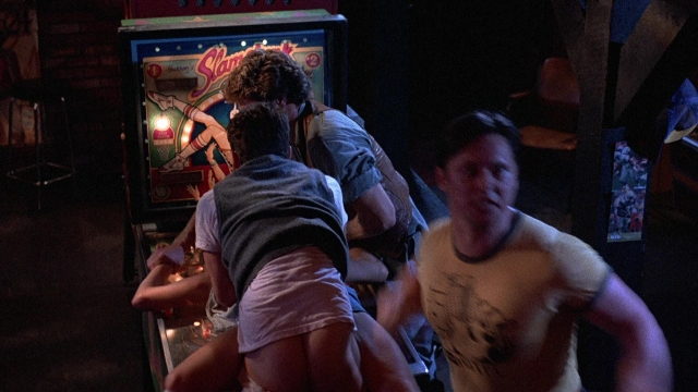 Medium shot frame from The Accused — standing, room, shirt