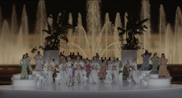 Wide shot frame from The Godfather: Part II — standing, room, fountain