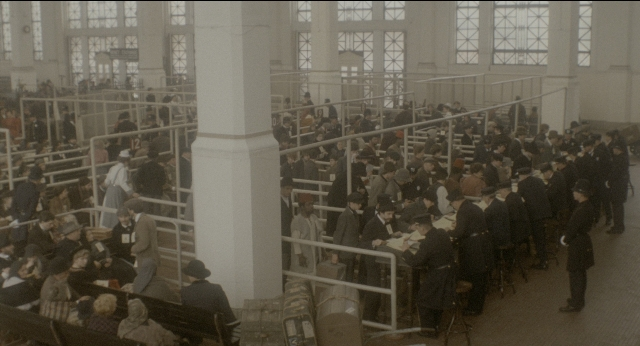 Wide shot frame from The Godfather: Part II — sitting, standing, room