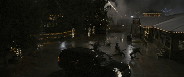 Wide shot frame from Zombieland — walking, street, car