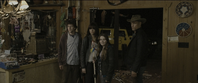 Wide shot frame from Zombieland — standing, room, table