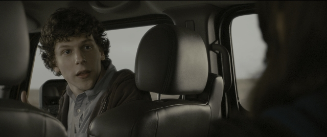 Medium shot frame from Zombieland — sitting, car, face