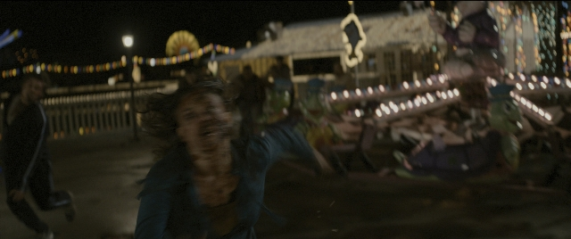 Wide shot frame from Zombieland — night, shirt, hair