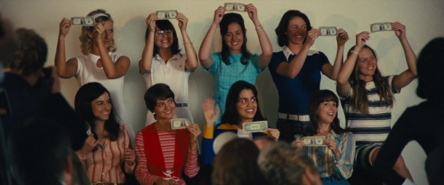 Wide shot frame from Battle of the Sexes — standing, room, person