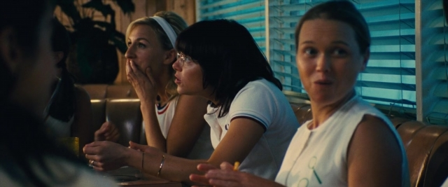 Medium shot frame from Battle of the Sexes — sitting, table, dialogue