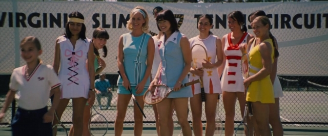 Wide shot frame from Battle of the Sexes — standing, bracelet, person
