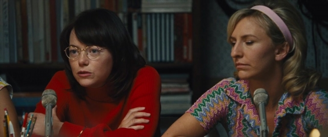Medium shot frame from Battle of the Sexes — sitting, table, dialogue