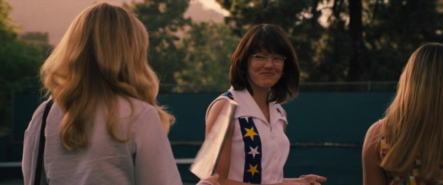 Wide shot frame from Battle of the Sexes — standing, dialogue, shirt