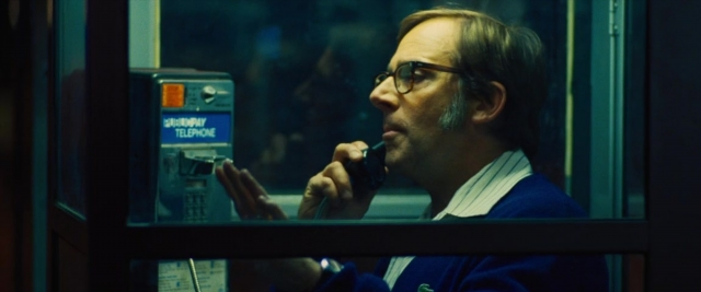 Frame from Battle of the Sexes — sitting, room, dialogue