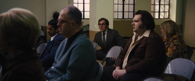 Wide shot frame from Battle of the Sexes — sitting, room, dialogue