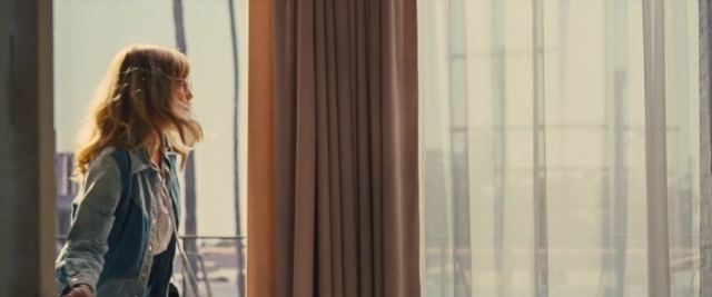 Frame from Battle of the Sexes — standing, jacket, hair