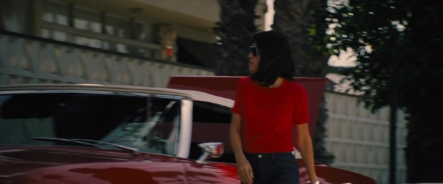 Frame from Battle of the Sexes — standing, car, hand