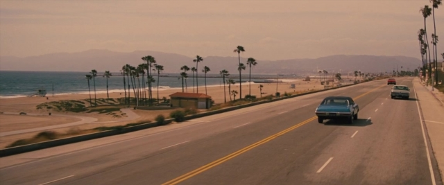 Frame from Battle of the Sexes — street, car, wheel