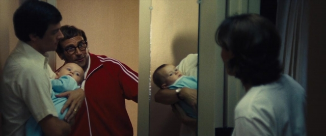 Frame from Battle of the Sexes — standing, room, mirror