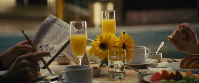 Frame from Battle of the Sexes — plate, table, hand