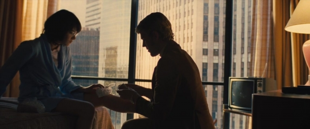 Frame from Battle of the Sexes — sitting, room, bed